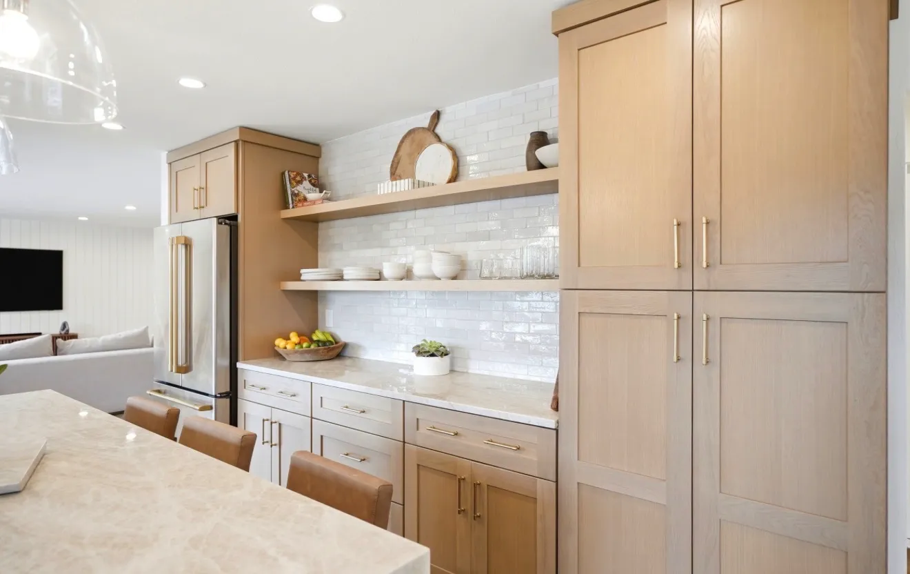 White oak kitchen with open shelving and counter seating