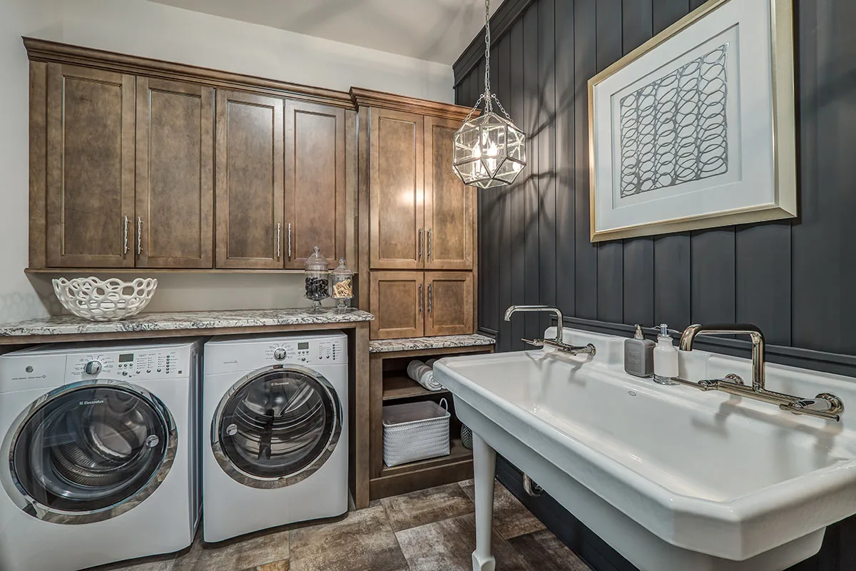 Laundry room cabinetry from Wellborn Forest