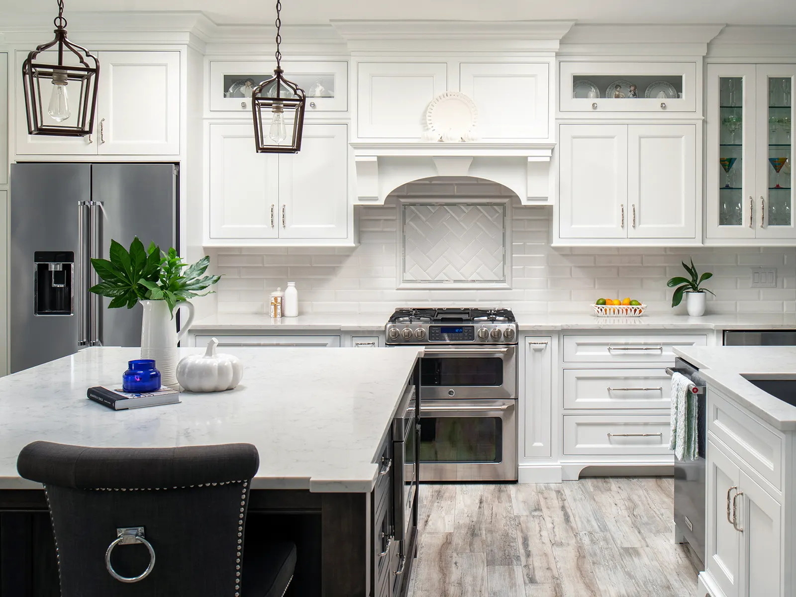 White shaker cabinetry with a dark island